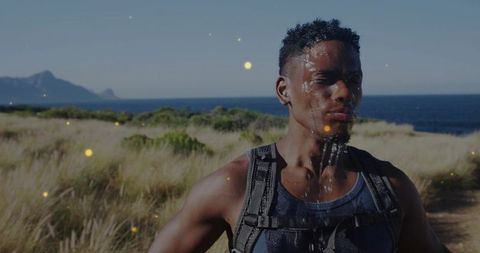 Hiker pausing for refreshment on scenic coastal trail