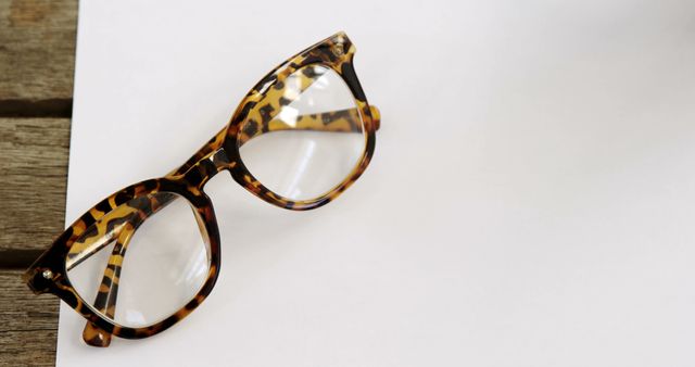 Tortoise Shell Glasses on Blank Paper and Wooden Desk - Download Free Stock Images Pikwizard.com