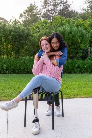 Interracial Couple Sharing Moment on Patio with Prosthetic Leg Visible