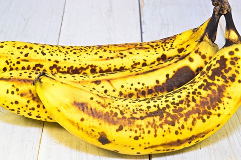 Ripe Spotty Bananas on Wooden Table