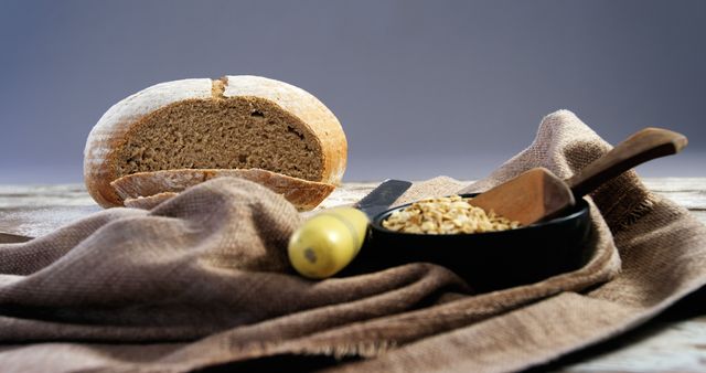 Fresh Artisanal Bread Loaf with Wooden Spoon and Wheat Grain - Download Free Stock Images Pikwizard.com