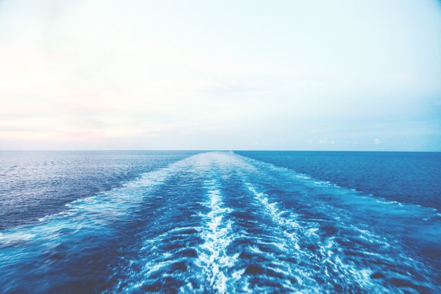 Endless Ocean Horizon with Wake Lines at Sunrise - Download Free Stock Photos Pikwizard.com