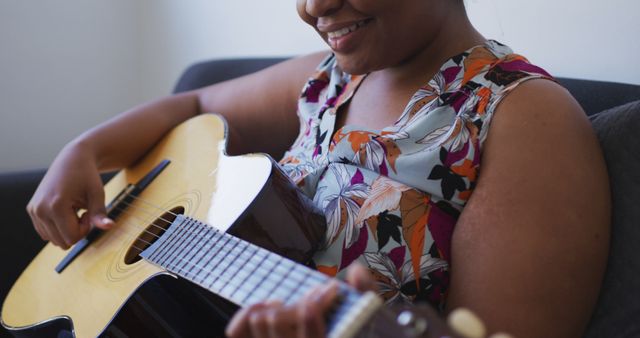 African American Woman Enjoying Playing Acoustic Guitar - Download Free Stock Images Pikwizard.com