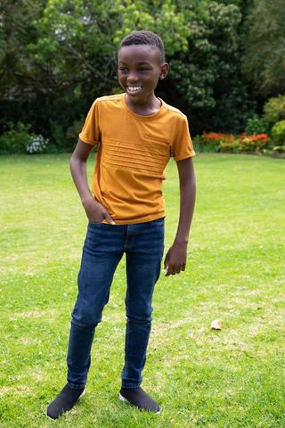 Smiling Boy Enjoying Backyard Sunshine