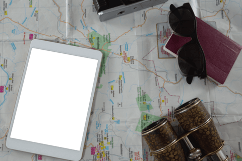 Transparent travel mockup with tablet, map and accessories