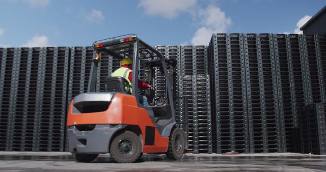 Worker Operating Forklift in Industrial Warehouse Yard with Stacked Containers - Download Free Stock Images Pikwizard.com