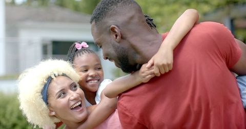 Happy African American Family Enjoying Quality Pool Time Together