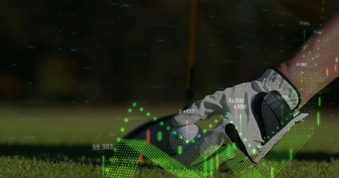 Golfer placing ball on tee with vibrant candlestick monitor display