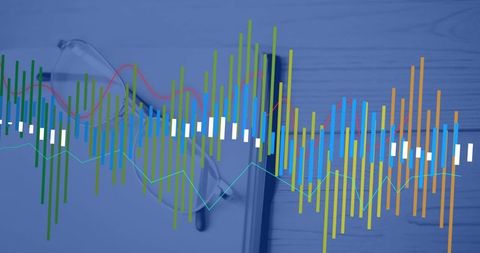 Data visualization on wooden desk with glasses and notebook