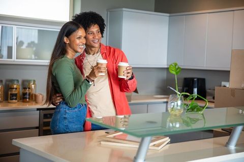 Couple Enjoying Coffee in Stylish Modern Kitchen Setting