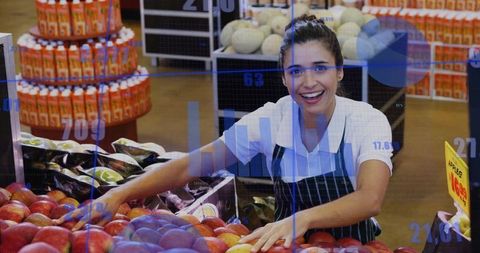 Happy Supermarket Clerk Arranging Fresh Red Apples