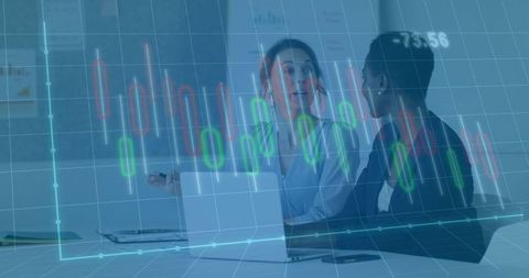 Businesswomen Analyzing Financial Candlestick Charts in Modern Office