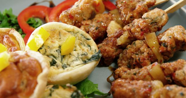 Delicious Bite-Sized Finger Food with Chicken Skewers and Mini Pies - Download Free Stock Photos Pikwizard.com