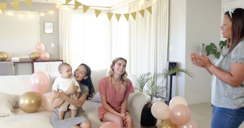 Celebration for Baby's Birthday Amidst Friends and Joyful Decor