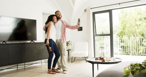 Engagement Celebration with Selfie and Rose in Modern Home