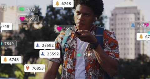 Speaking into smartphone wearing earbuds in urban park with social media notifications