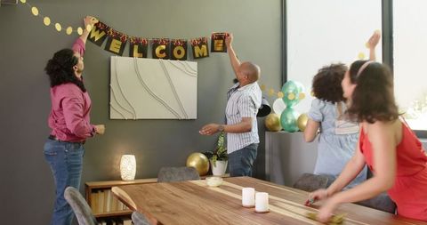 Eclectic friends decorating for home celebration