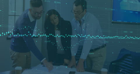 Team Analyzing Statistical Data in Modern Office