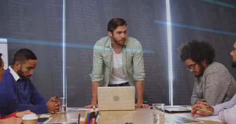 Project manager leading data-driven team meeting in modern office