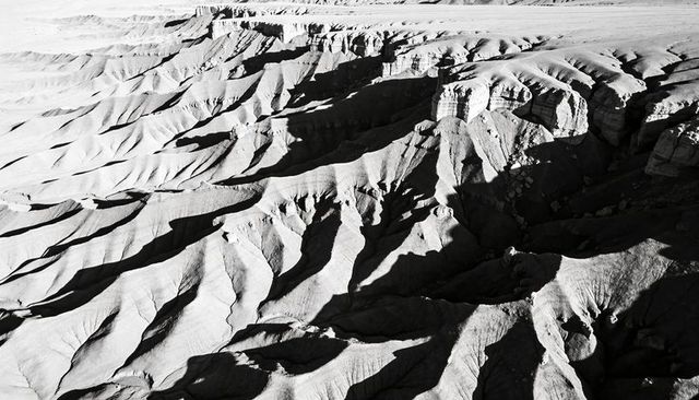 Badlands eroding into ribbed ridges and deep gullies on high desert plateau