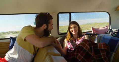 Happy Couple Relaxing in Camper Van on Road Trip Adventure - Download Free Stock Images Pikwizard.com