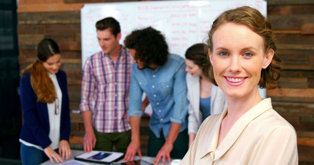 Confident Businesswoman Leading Meeting with Team Members - Download Free Stock Images Pikwizard.com