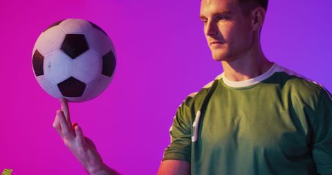 Confident soccer player performing ball trick