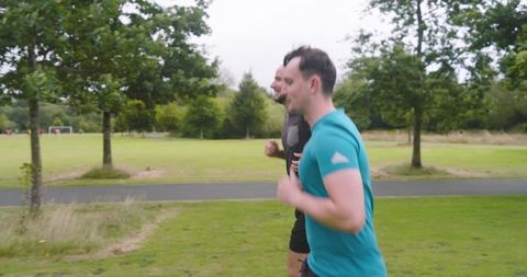 Men jogging in park embracing active outdoor lifestyle