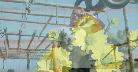 Athletic Young Man at Adventure Course with Flower Overlay