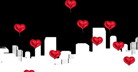 Heart Balloons Float Over City Silhouette at Night