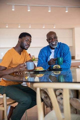 Father and Son Sharing Breakfast at Home