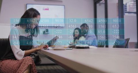Business Meeting with Stock Market Data Overlay