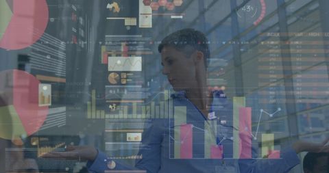 Businessman Analyzing Data with Digital Charts Overlay - Download Free Stock Images Pikwizard.com