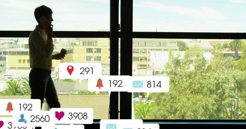 Urban Professional Engaged with Mobile Notifications in Office