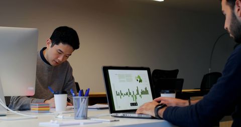 Focused Business Team Analyzing Financial Reports in Modern Office - Download Free Stock Images Pikwizard.com
