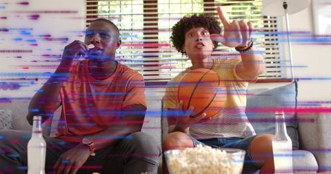 Friends Watching Basketball Game Couch Holding Ball Eating Popcorn with Glitch Overlay