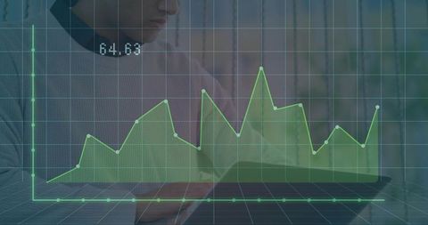 Business professional analyzing data with holographic line chart