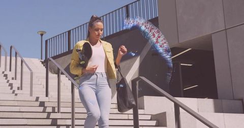 Woman walking urban stairs holding skateboard and tote bag with colorful digital light arc