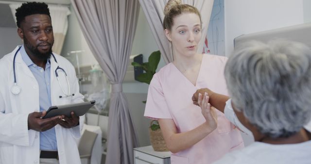 Medical Team Consulting Elderly Patient in Clinic - Download Free Stock Images Pikwizard.com