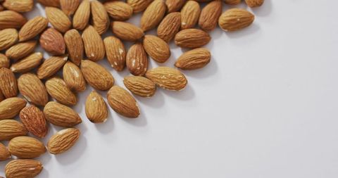 Almonds Scattered on Clean White Background - Download Free Stock Images Pikwizard.com