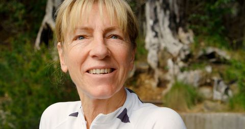 Smiling Mature Woman Enjoying Outdoor Nature Experience