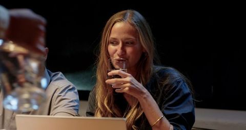 Professional woman enjoying evening office collaboration