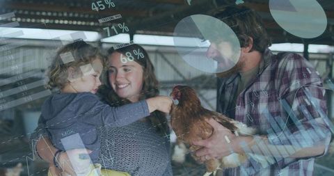Young family interacting with hen inside barn with agricultural data overlays and poultry analytics