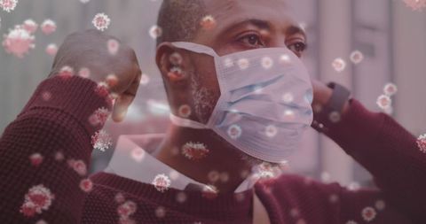 Man Wearing Mask Amidst Floating COVID-19 Particles Conceptual Image - Download Free Stock Images Pikwizard.com