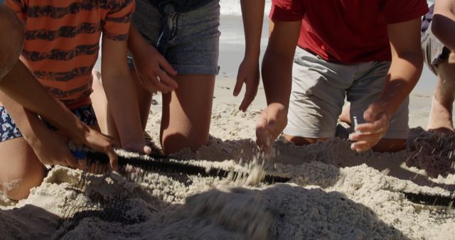 Group of friends building a sandcastle on beach. This photo can be used for articles or advertisements about friendship, teamwork, summer vacations, leisure activities, or outdoor fun. It showcases hands working together in sand, evoking a sense of involvement and collaboration.