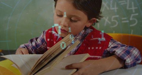 Young boy reading book at school desk with holographic digital learning overlay