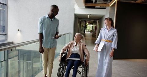 Diverse professional colleagues in office environment engaging in discussion