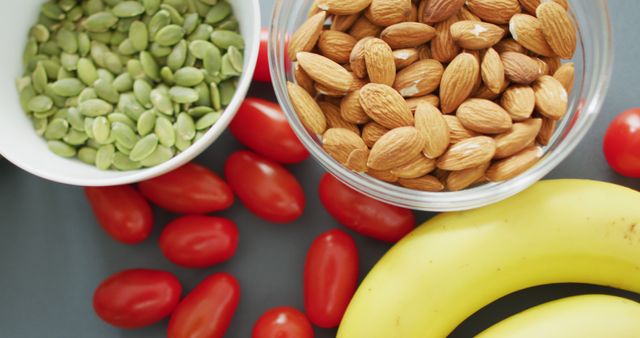 Healthy Snack Choices with Nuts, Seeds, Cherry Tomatoes and Bananas - Download Free Stock Images Pikwizard.com