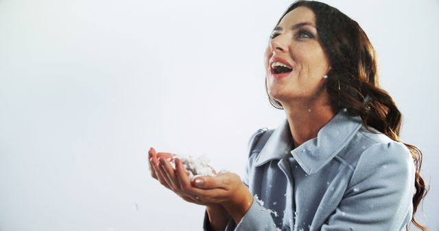 Joyful Woman Enjoying Snowfall in Winter Coat - Download Free Stock Images Pikwizard.com