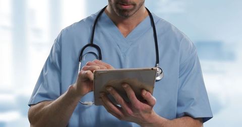 Healthcare Professional Using Tablet for Patient Management - Download Free Stock Images Pikwizard.com